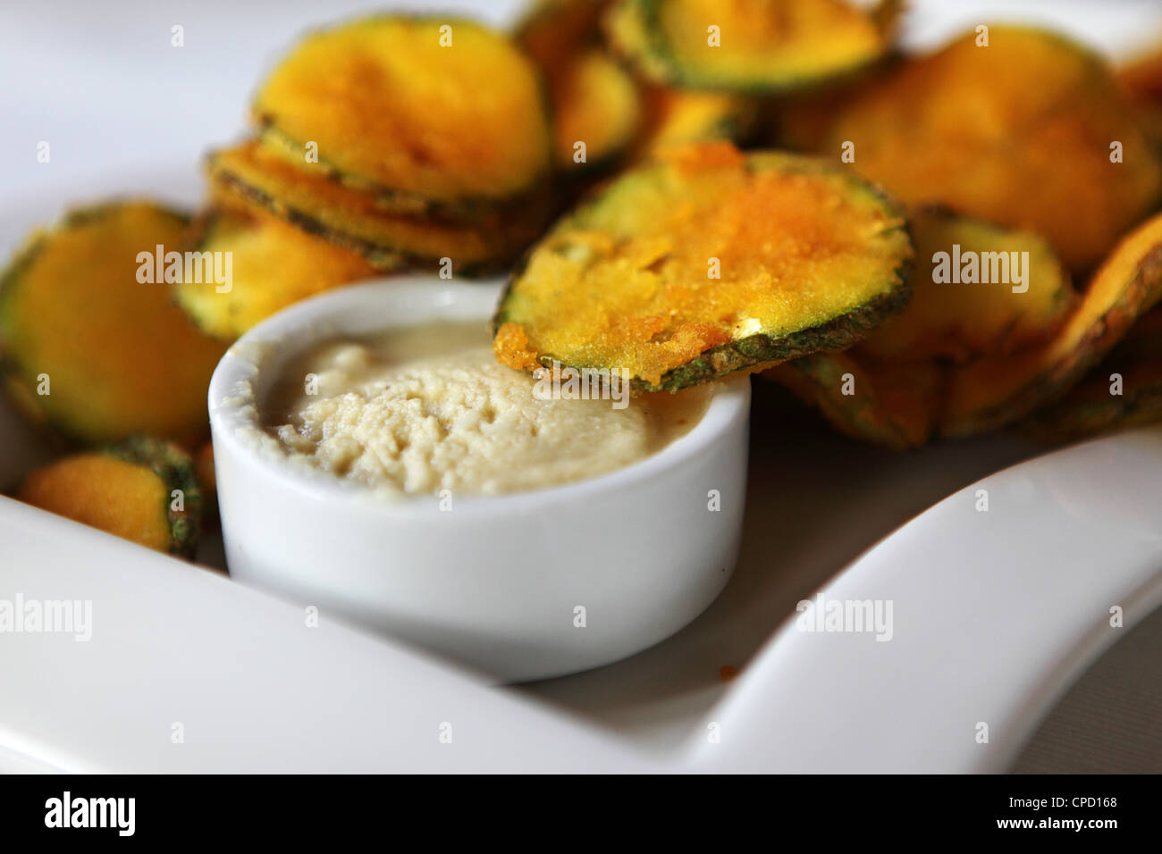 Aubergine chips are served with a dip in a restaurant in Arnea, Halkidiki, Greece. Stock Photo