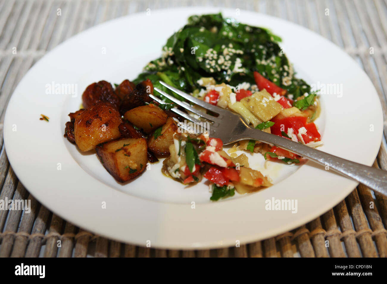 Salad and potatoes are served in Ouranoupoli, Greece. Stock Photo