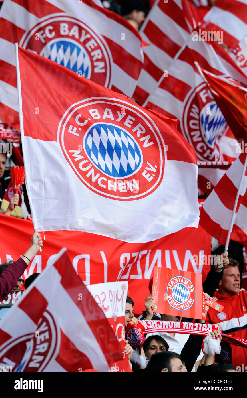 Supporters of FC Bayern Muenchen with flags, during the German Cup Final at the Olympic Stadium Berlin. Stock Photo