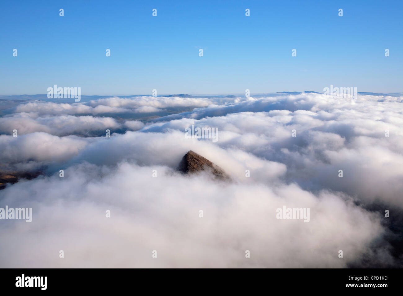 Peak of Y Lliwedd poking through the cloud from the summit of Mt Snowdon (Yr Wyddfa). Snowdonia National Park. Gwynedd. Wales Stock Photo