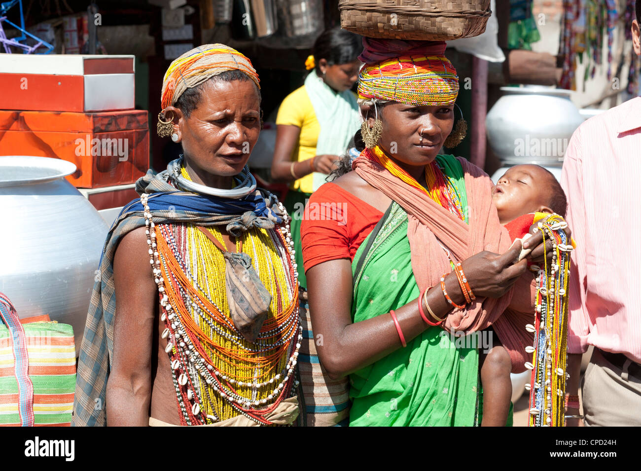 Two Bonda tribeswoman and baby in traditional bead costume, Rayagader, Orissa, India Stock Photo
