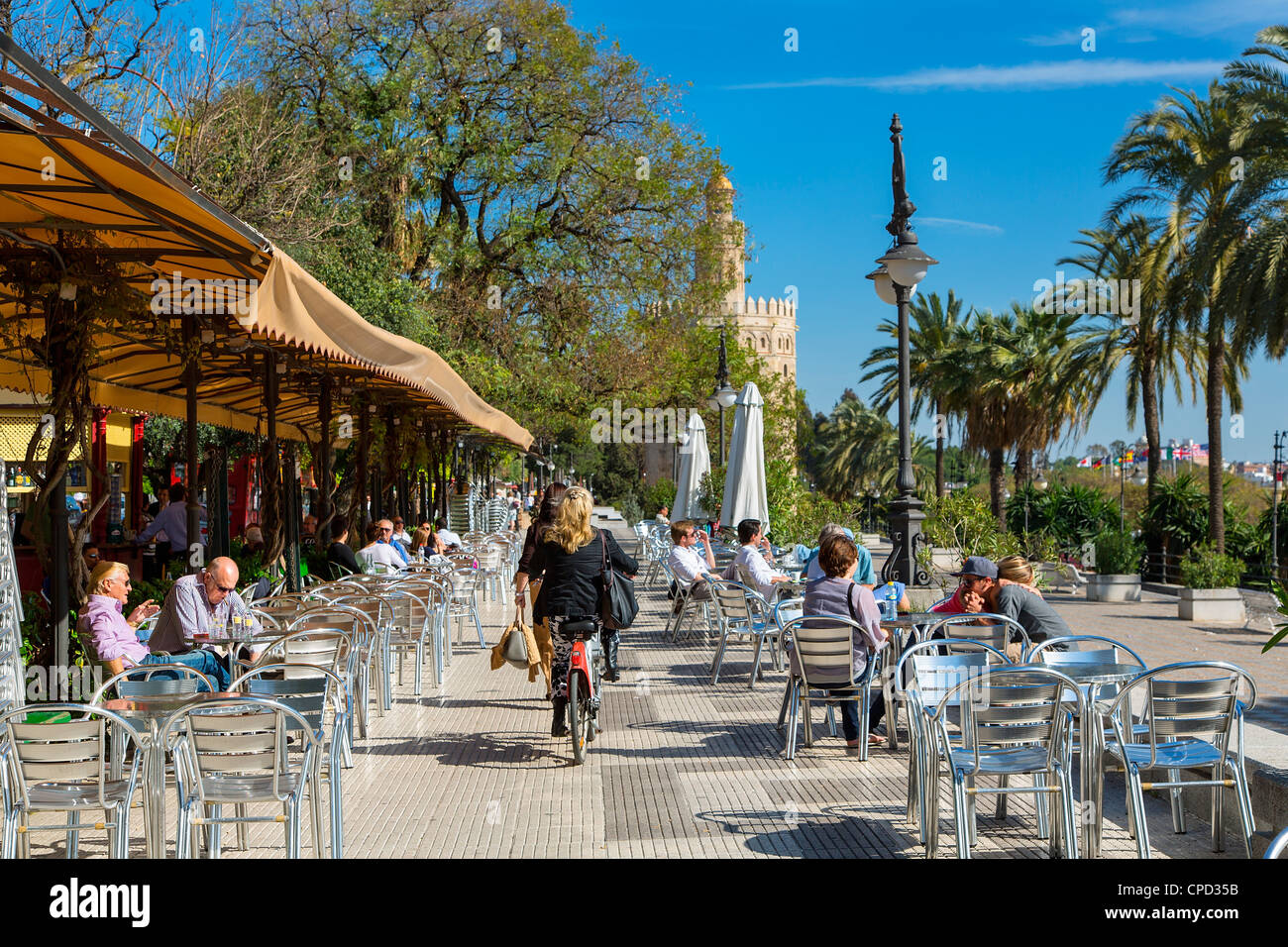 Seville, Promenade along Guadalquivir, the Golden Tower (Torre del Oro) Stock Photo