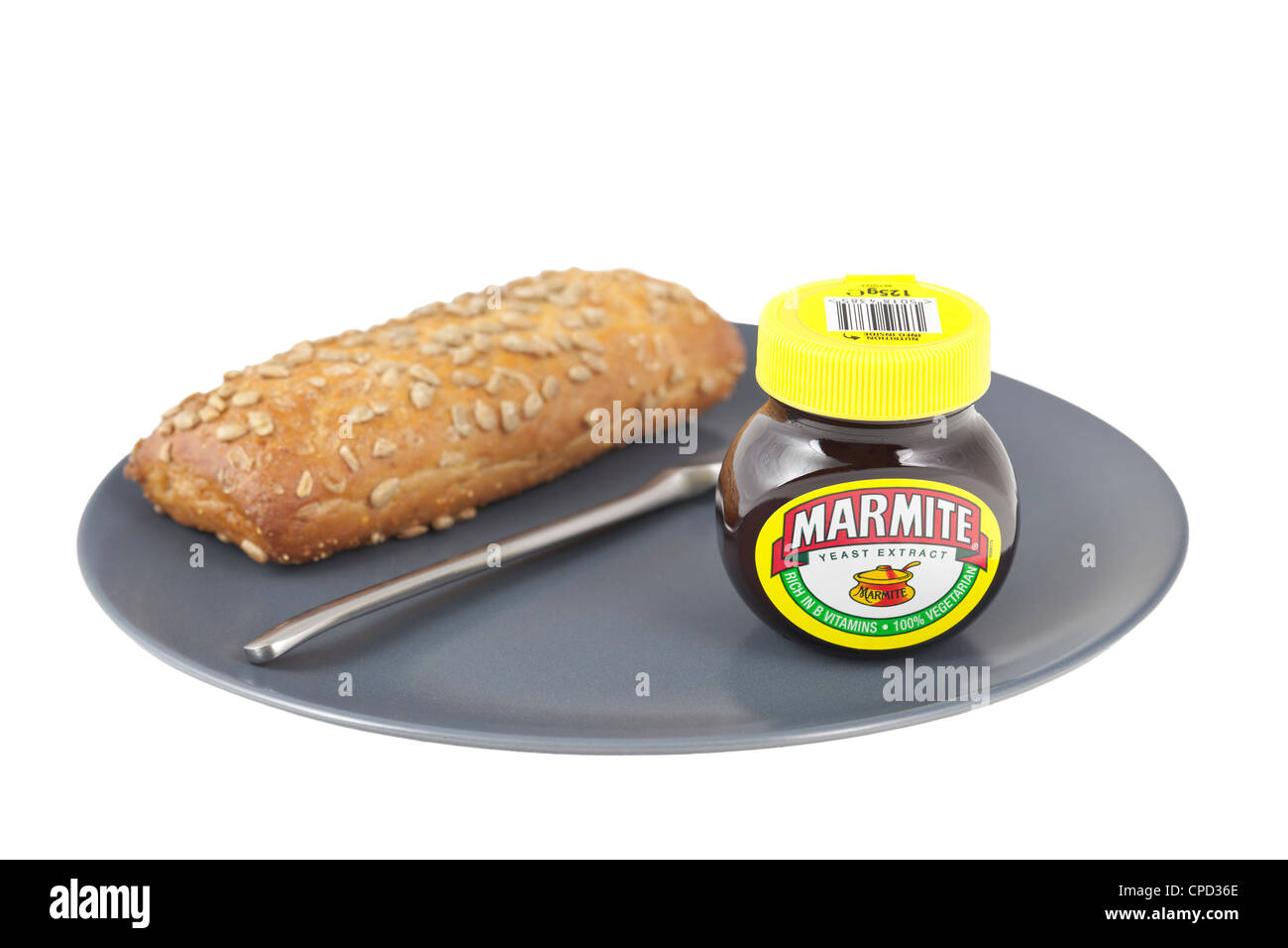 Marmite jar with bread on a plate Stock Photo