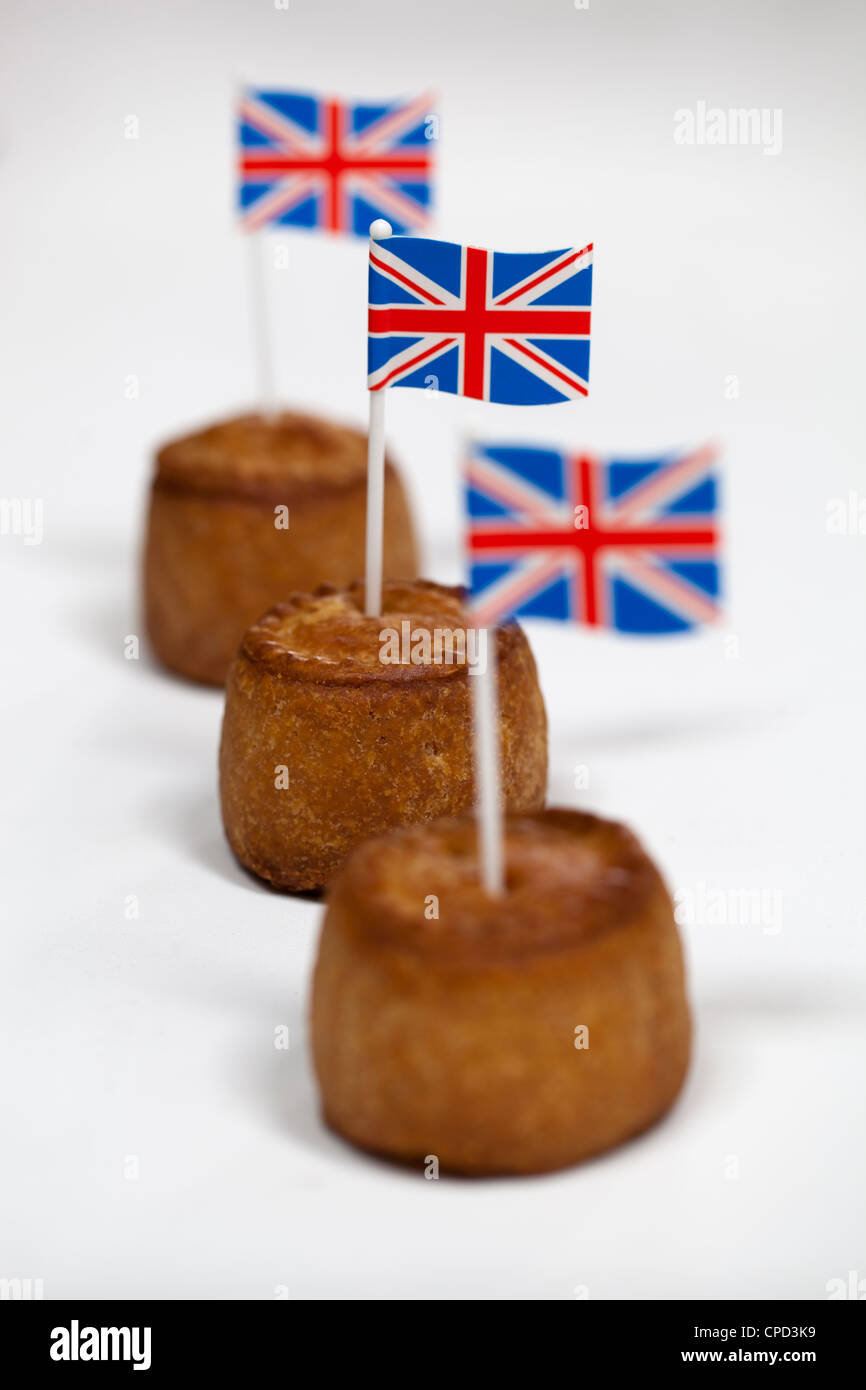 British Pork Pies with union jack flag on white background Stock Photo