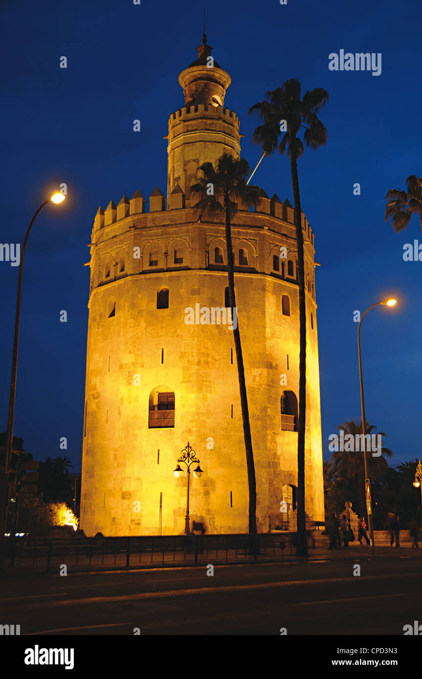 Spain. Andalusia. Seville. The Gold Tower (Torre del Oro) by night. 13th century. Almohad dynasty. Stock Photo