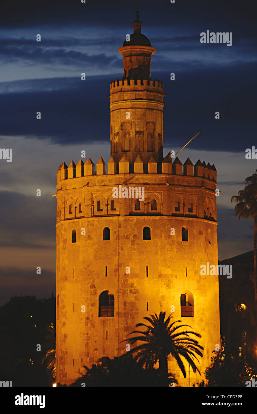 Spain. Andalusia. Seville. The Gold Tower (Torre del Oro) by night. 13th century. Almohad dynasty. Stock Photo