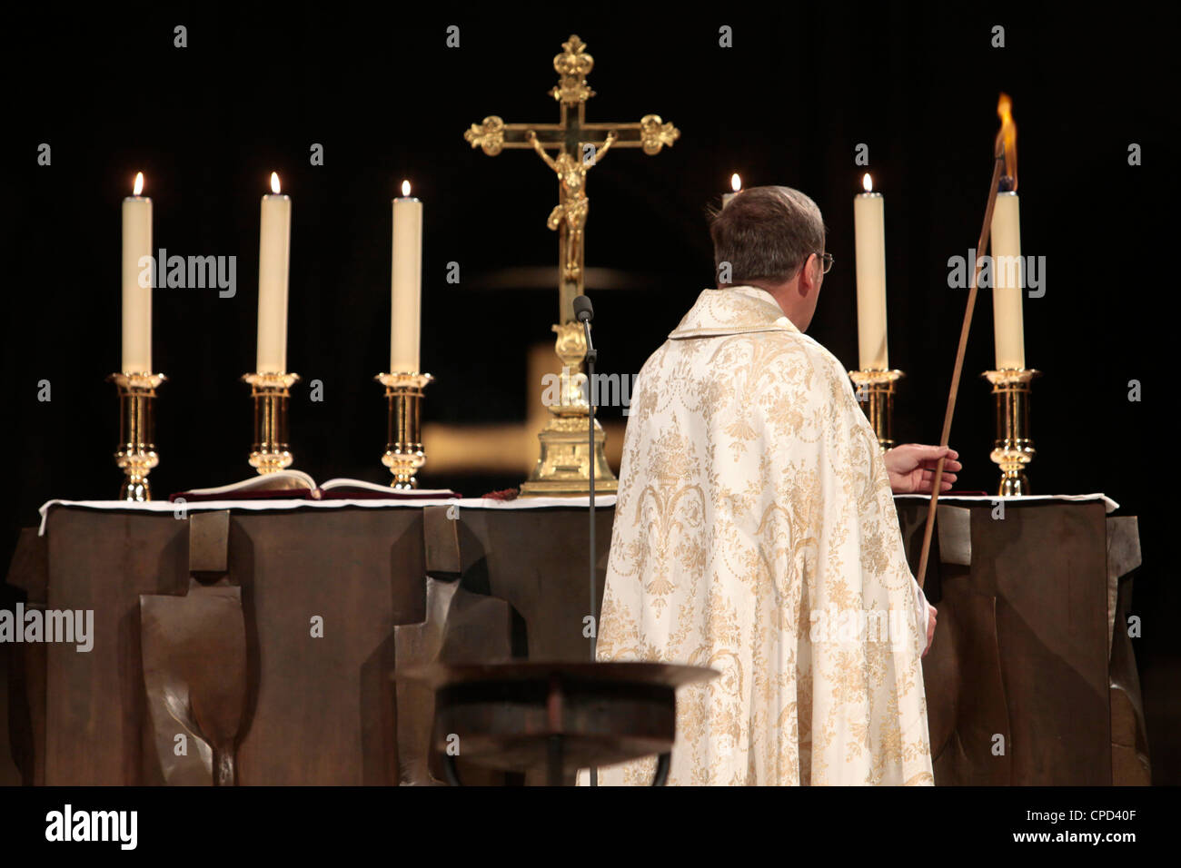 Altar candle lighting at NotreDame de Paris cathedral, Paris, France