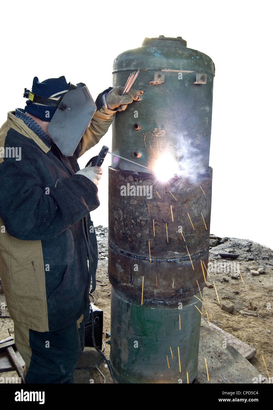 welder with sparks arcing Stock Photo
