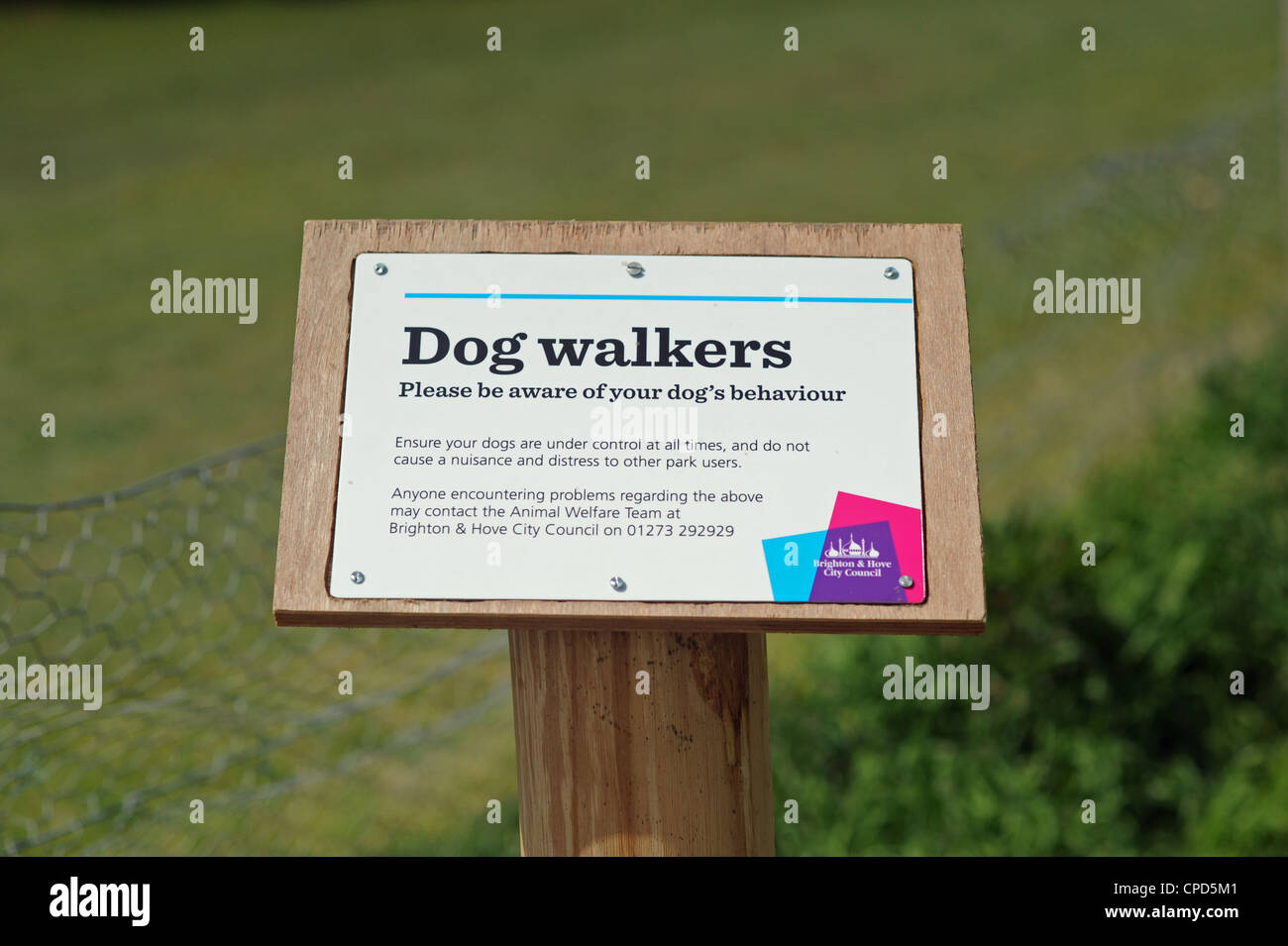 Dog behaviour Warning Sign to owners in Withdean Park Brighton UK issued by Brighton and Hove City Council Stock Photo