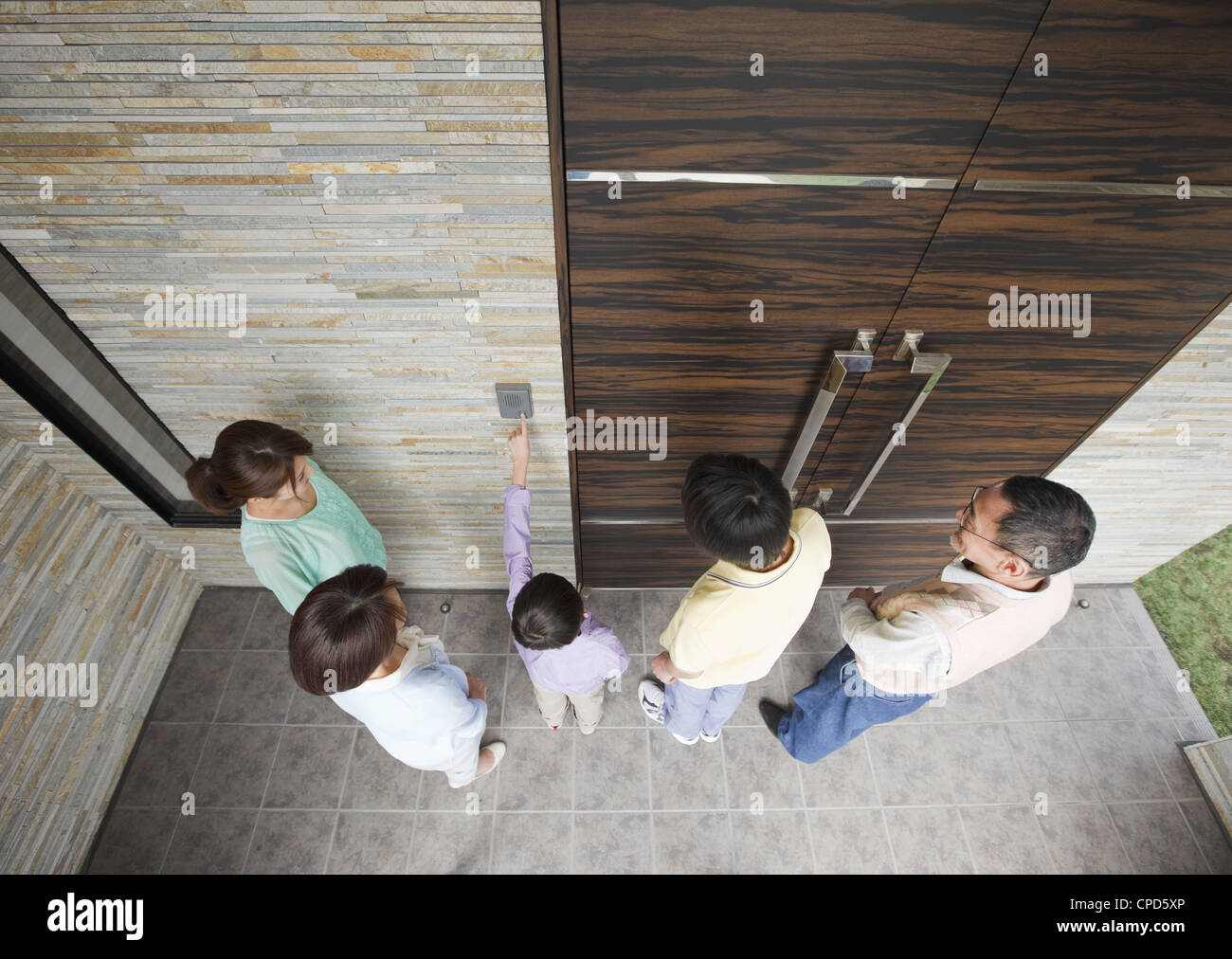 Family at front door Stock Photo - Alamy