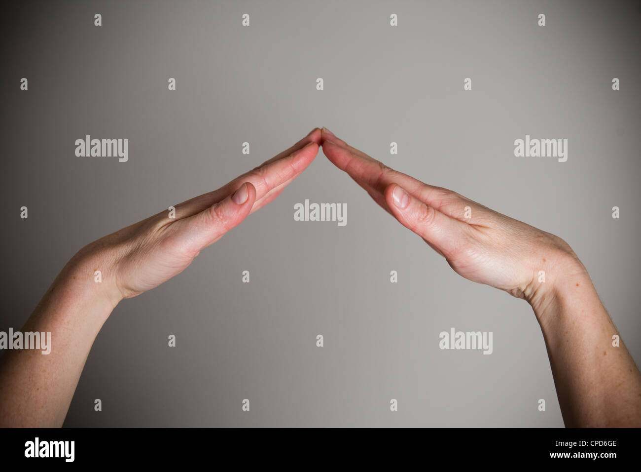 Two hands forming a bridge or roof Stock Photo