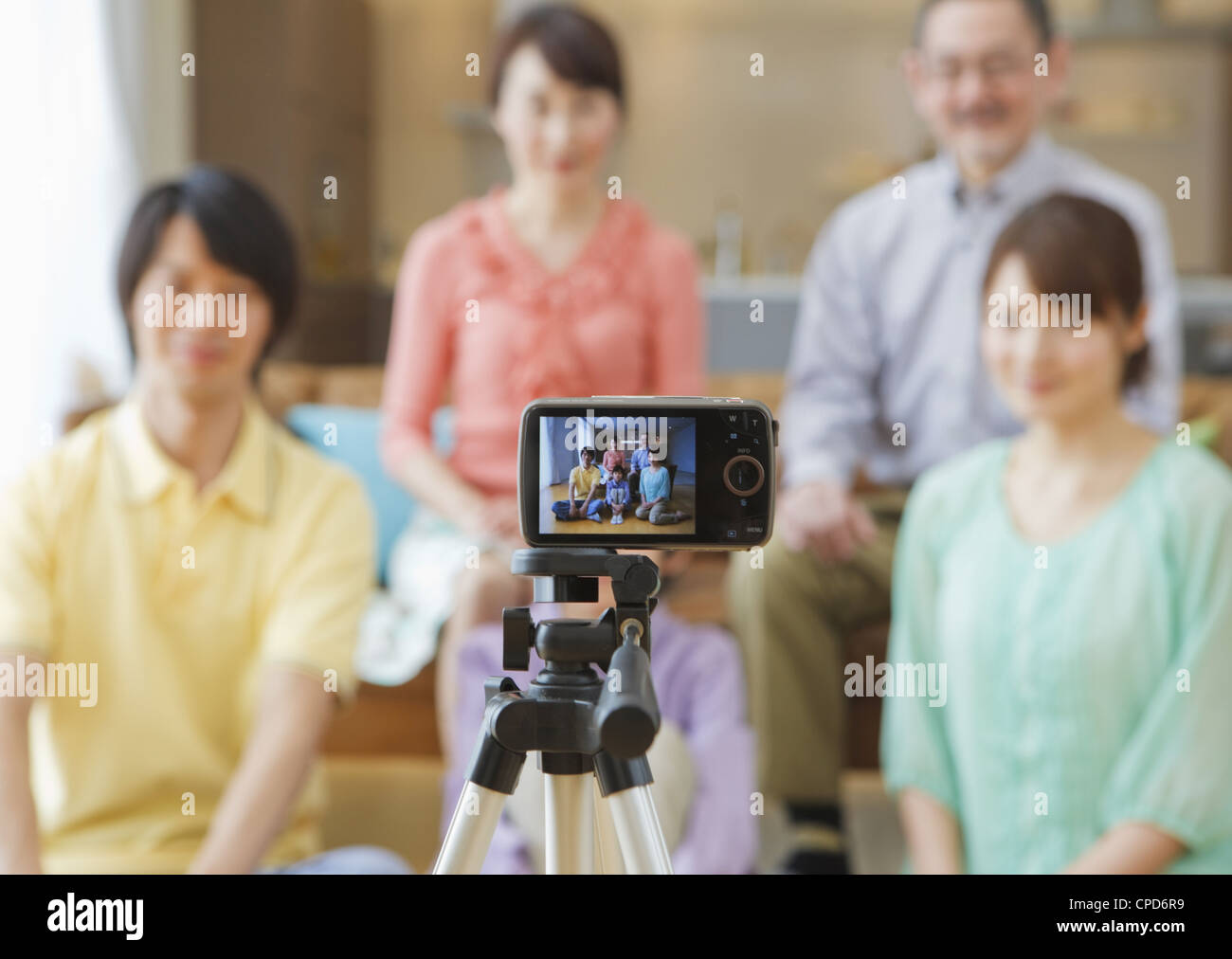 Three-generation family taking memorable photograph Stock Photo - Alamy