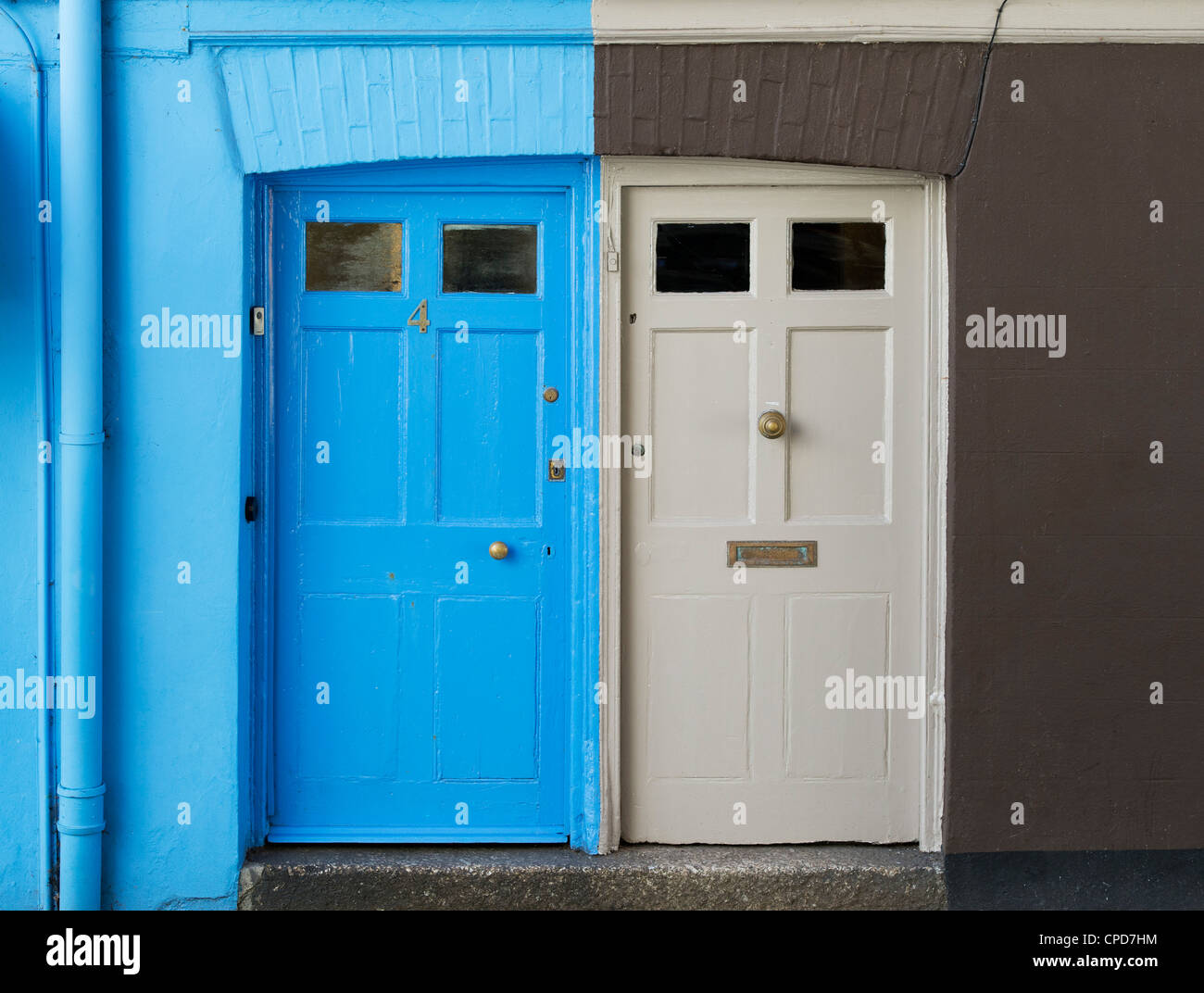 Blue / brown Painted doors. Fowey, Cornwall, England Stock Photo