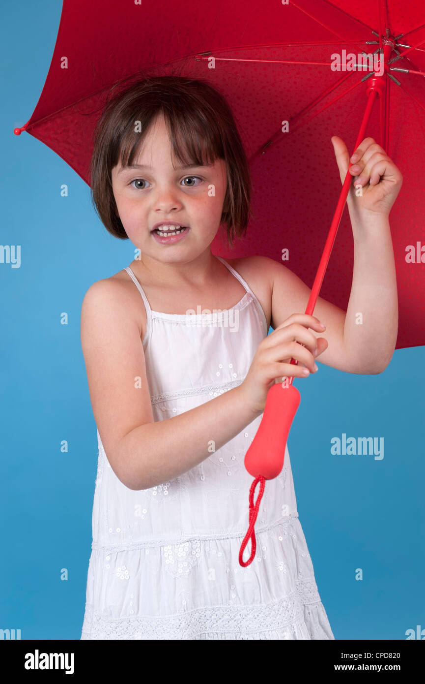 little girl with red umbrella Stock Photo Alamy