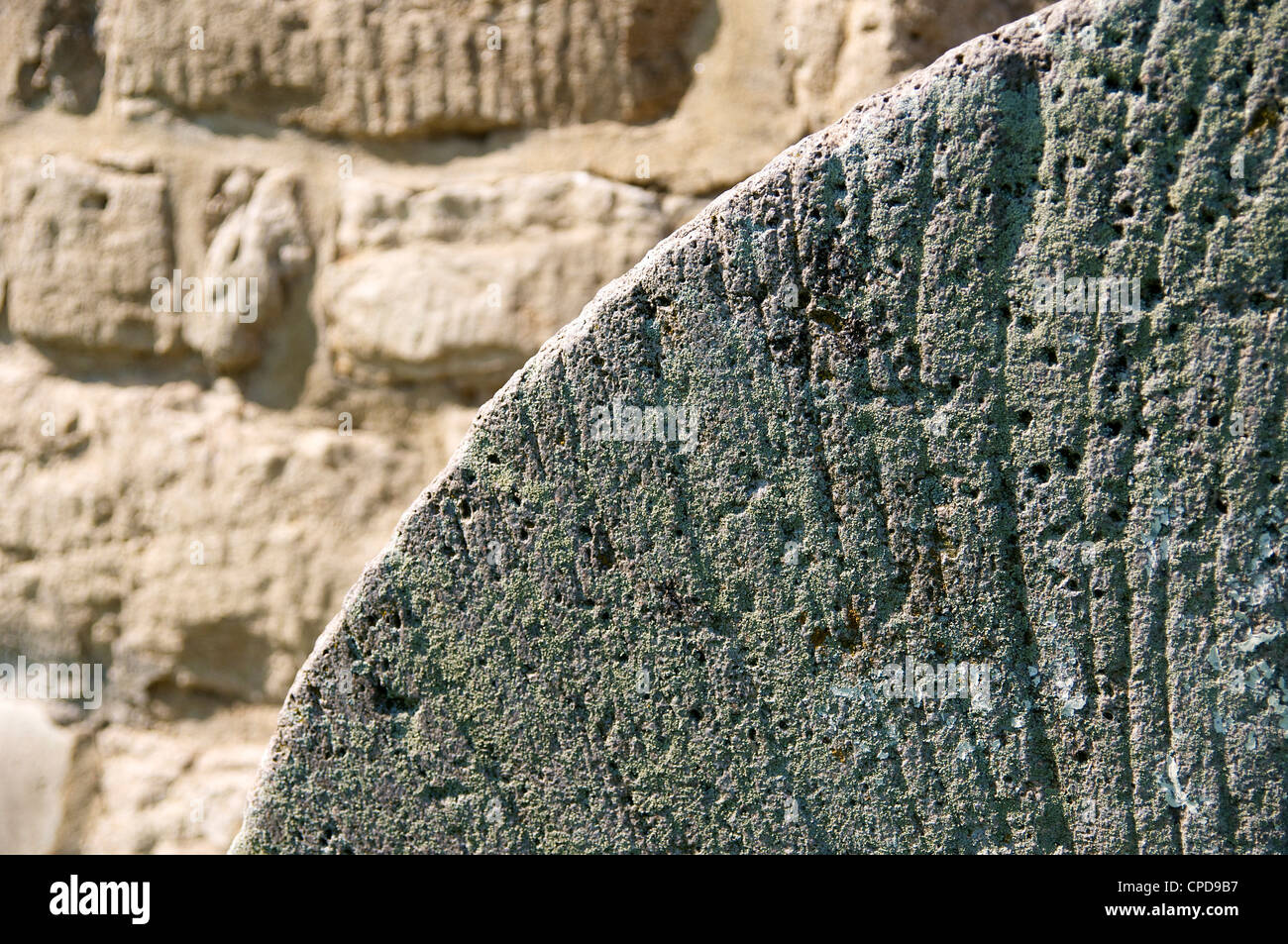 Detail of an old millstone with furrows at the mill in Eckartsberga (Germany). Stock Photo