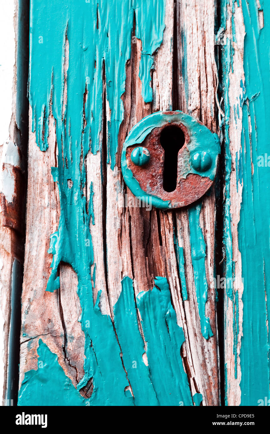 Old rusty lock on a decaying wooden door with peeling paint Stock Photo ...