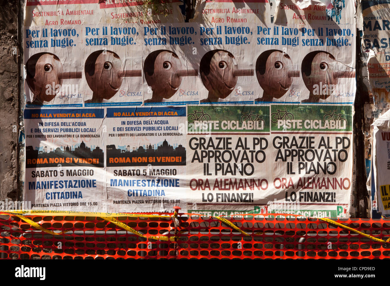 Political campaign posters against water privatisation with Pinocchio picture in Rome Stock Photo