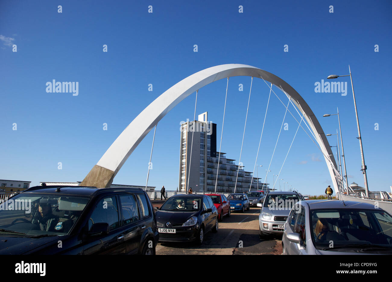 morning rushhour traffic on the Clyde Arc bridge over the river clyde in Glasgow Scotland UK Stock Photo