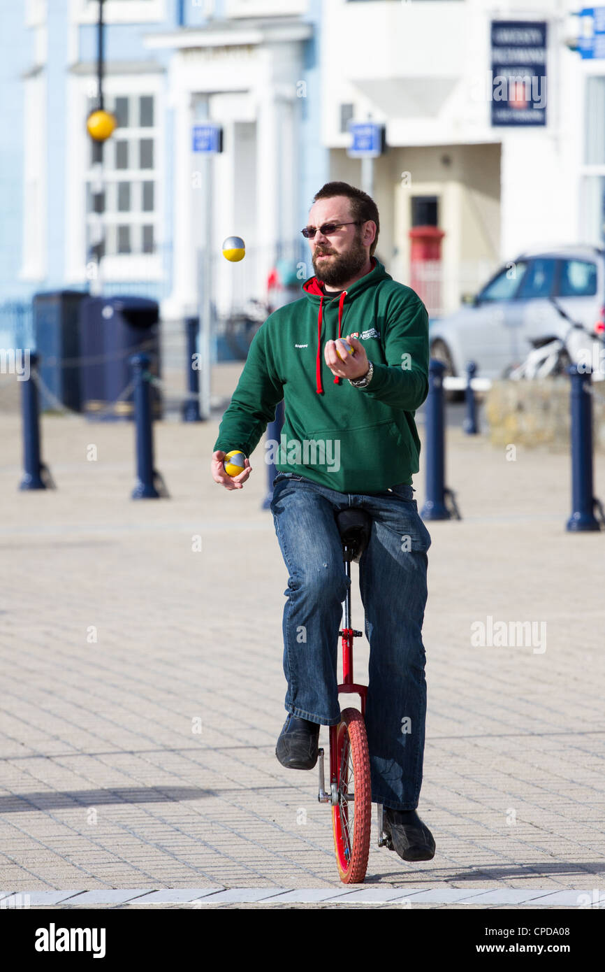 Juggling on a unicycle hires stock photography and images Alamy