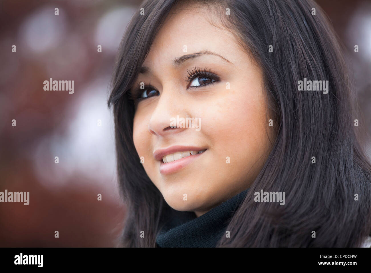 Smiling Hispanic teenage girl Stock Photo