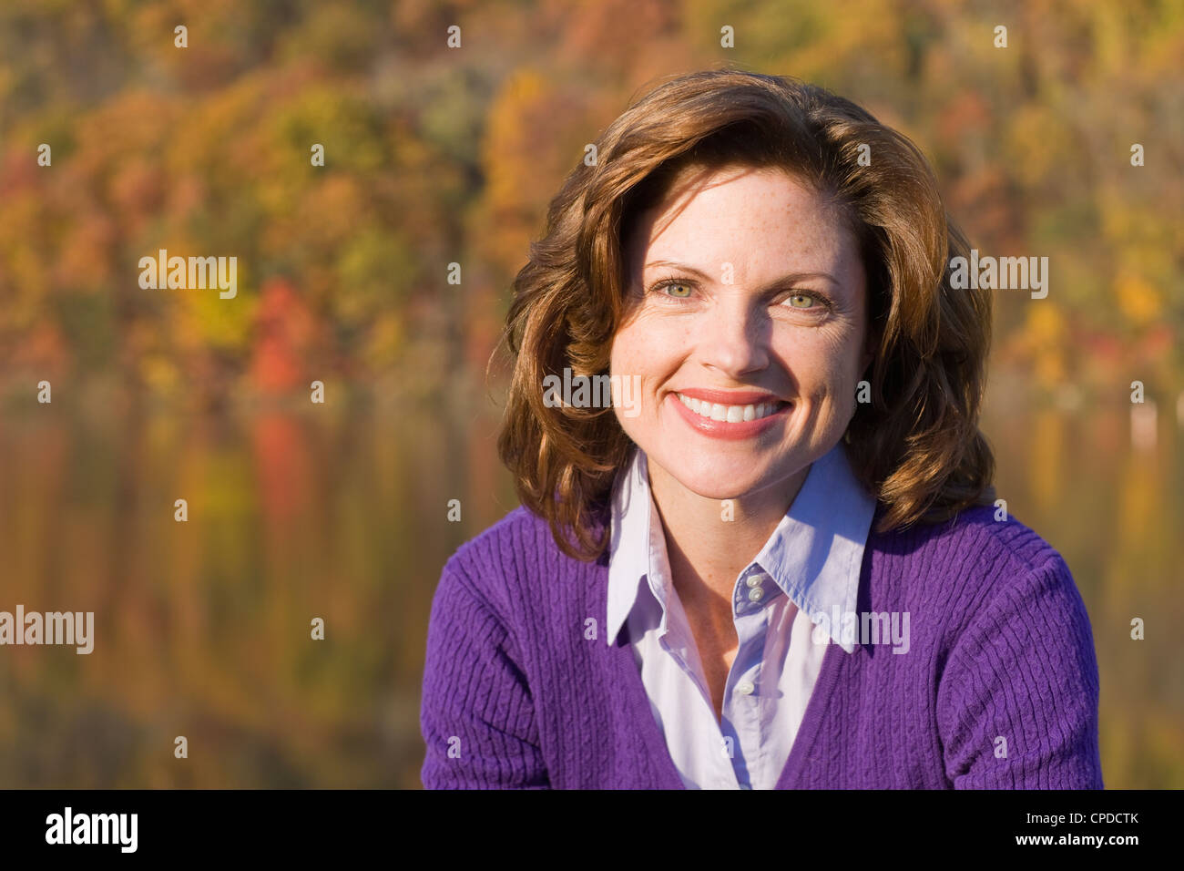 Smiling Caucasian woman outdoors in autumn Stock Photo - Alamy