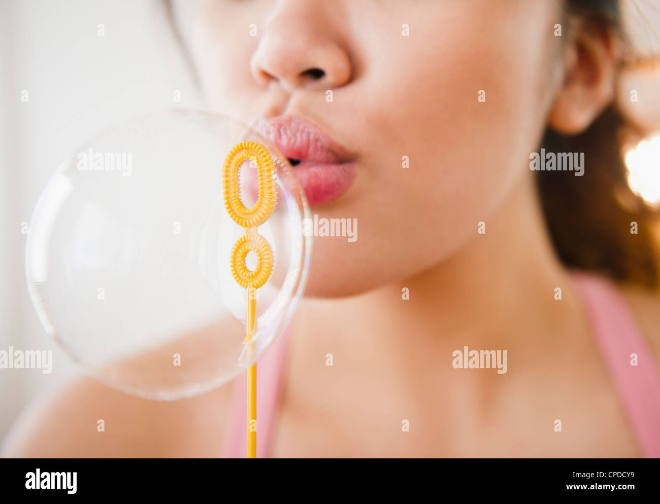 Pacific Islander woman blowing bubble Stock Photo
