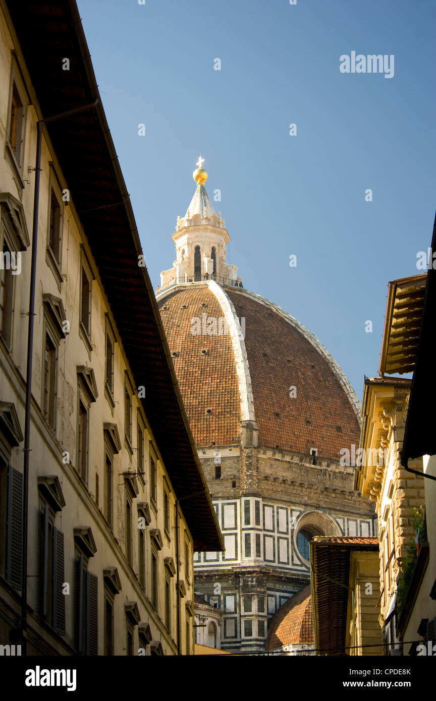 A view of the Duomo through old buildings in Florence, UNESCO World Heritage Site, Tuscany, Italy, Europe Stock Photo