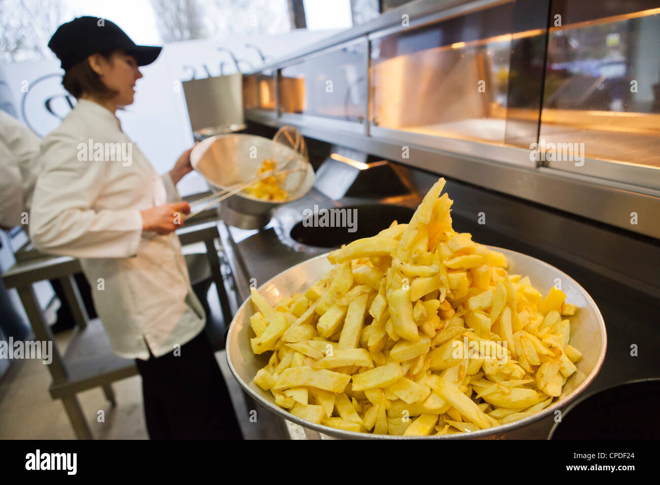 Chips being fried in traditional British chip shop, Gloucester