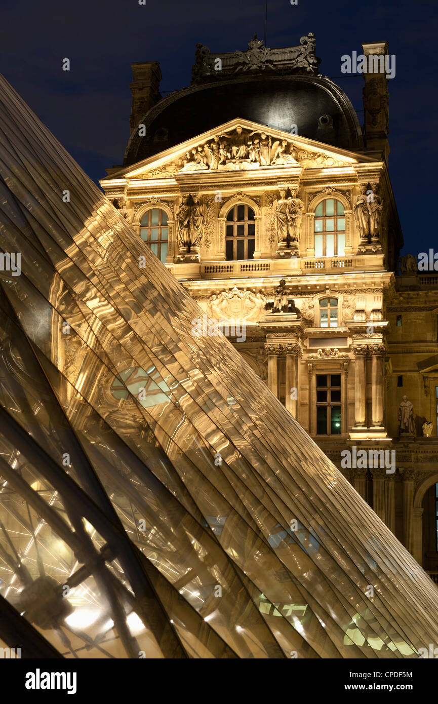 Louvre reflections in glass pyramid at twilight, Rue de Rivoli, Paris, France, Europe Stock Photo