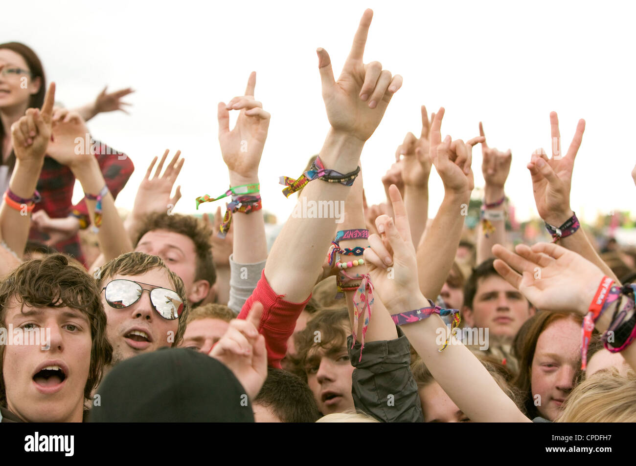 Hands in the air cheering at a music festicval Stock Photo - Alamy