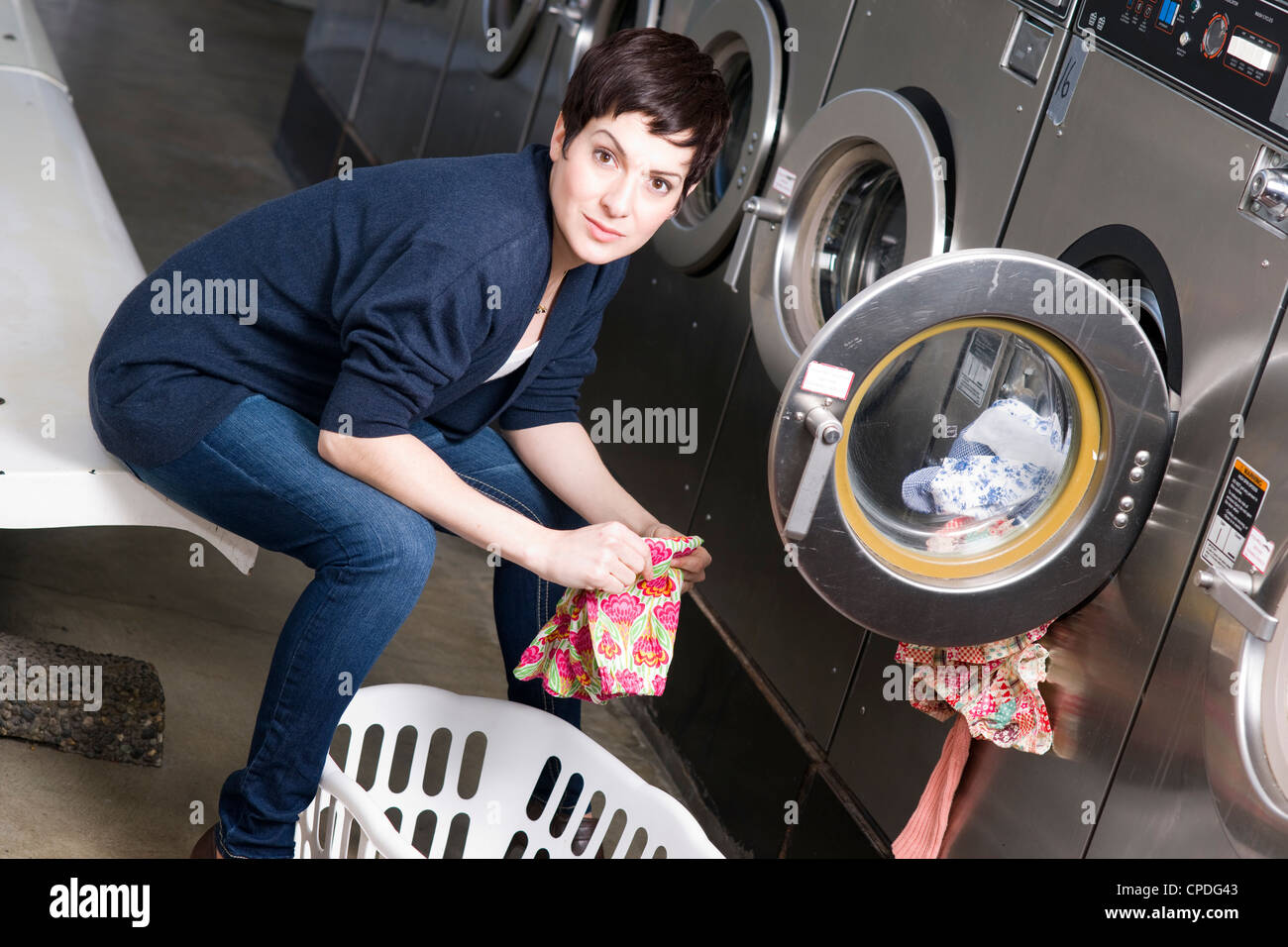 Lady laundromat hires stock photography and images Alamy