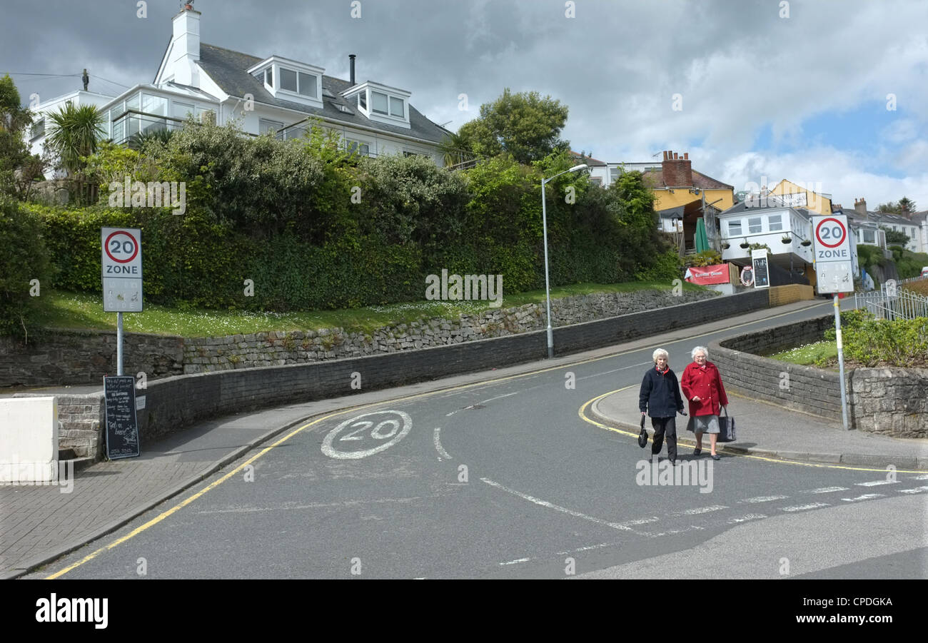 Two old ladies walking down a hill in Falmouth, UK Stock Photo