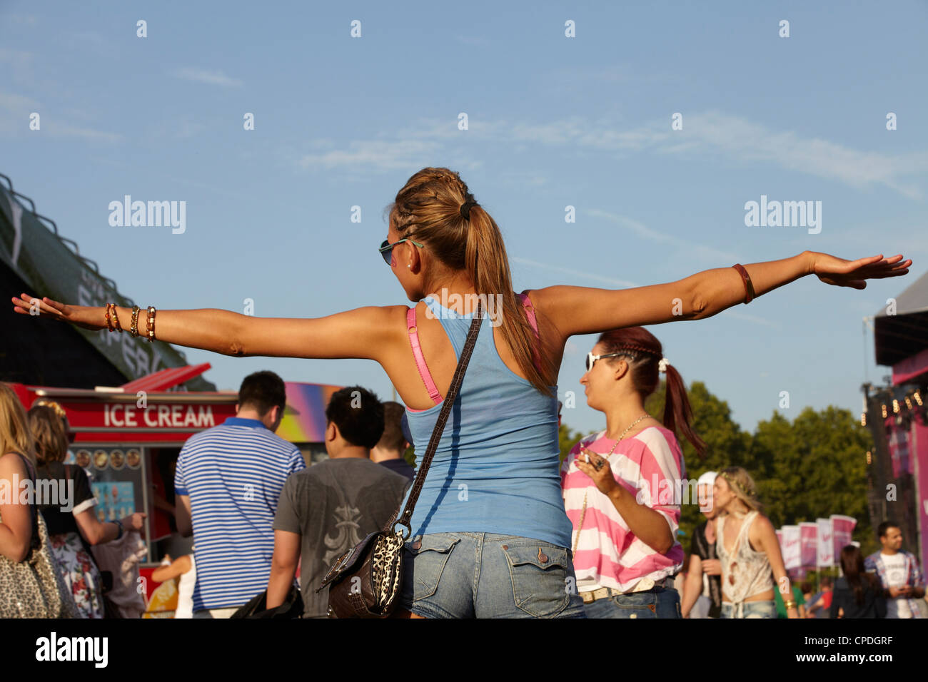 Girl dancing at a summer music festival Stock Photo - Alamy