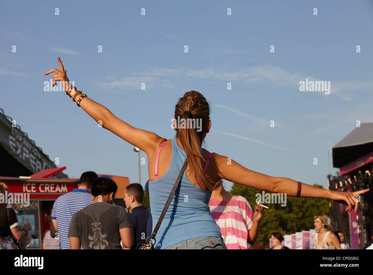 Girl dancing at a summer music festival Stock Photo - Alamy