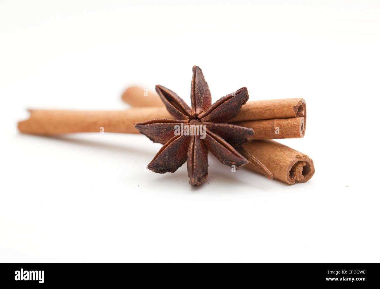 Cinnamon sticks with anise star on white background Stock Photo