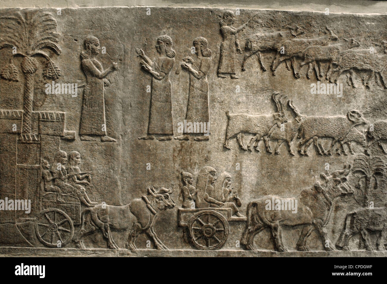 Campaigns of Tiglath-Pileser III in southern Iraq. The civilian prisoners and their belongings are led to the Assyrian king. Stock Photo