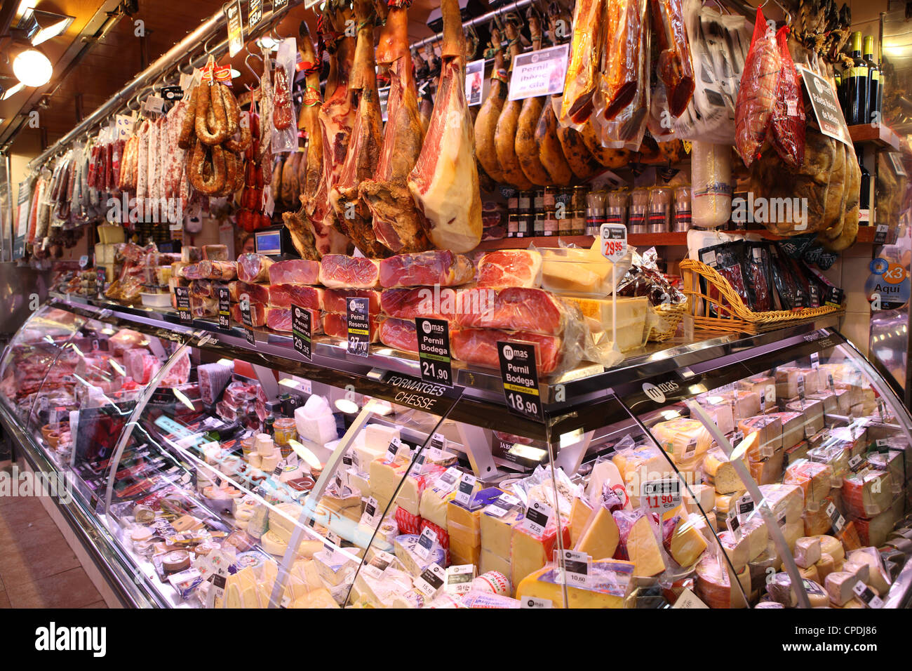 Hams hanging in market, Barcelona, Catalonia, Spain, Europe Stock Photo