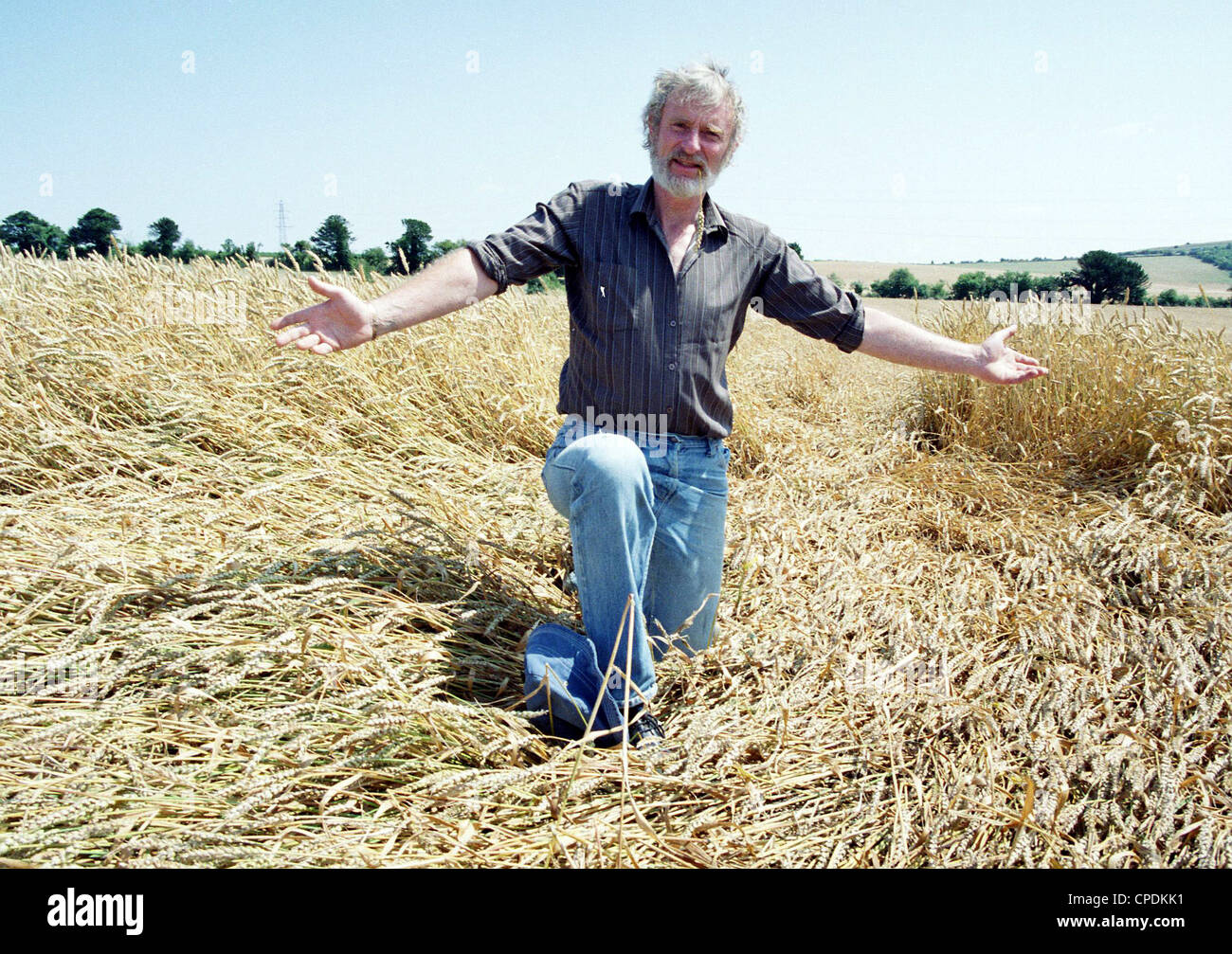 Wiltshire Farmer Malcolm Read with unexplained Corn circles on his farm in West Grimstead, England. Photographed for a local newspaper at the height of the crop circle mystery in the late 1980s. Stock Photo