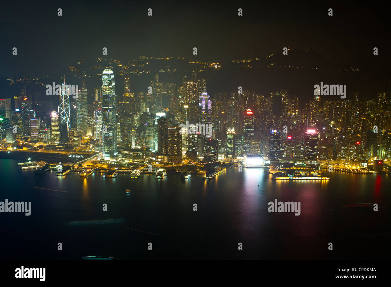 High view of the Hong Kong Island skyline and Victoria Harbour at night, Hong Kong, China, Asia Stock Photo