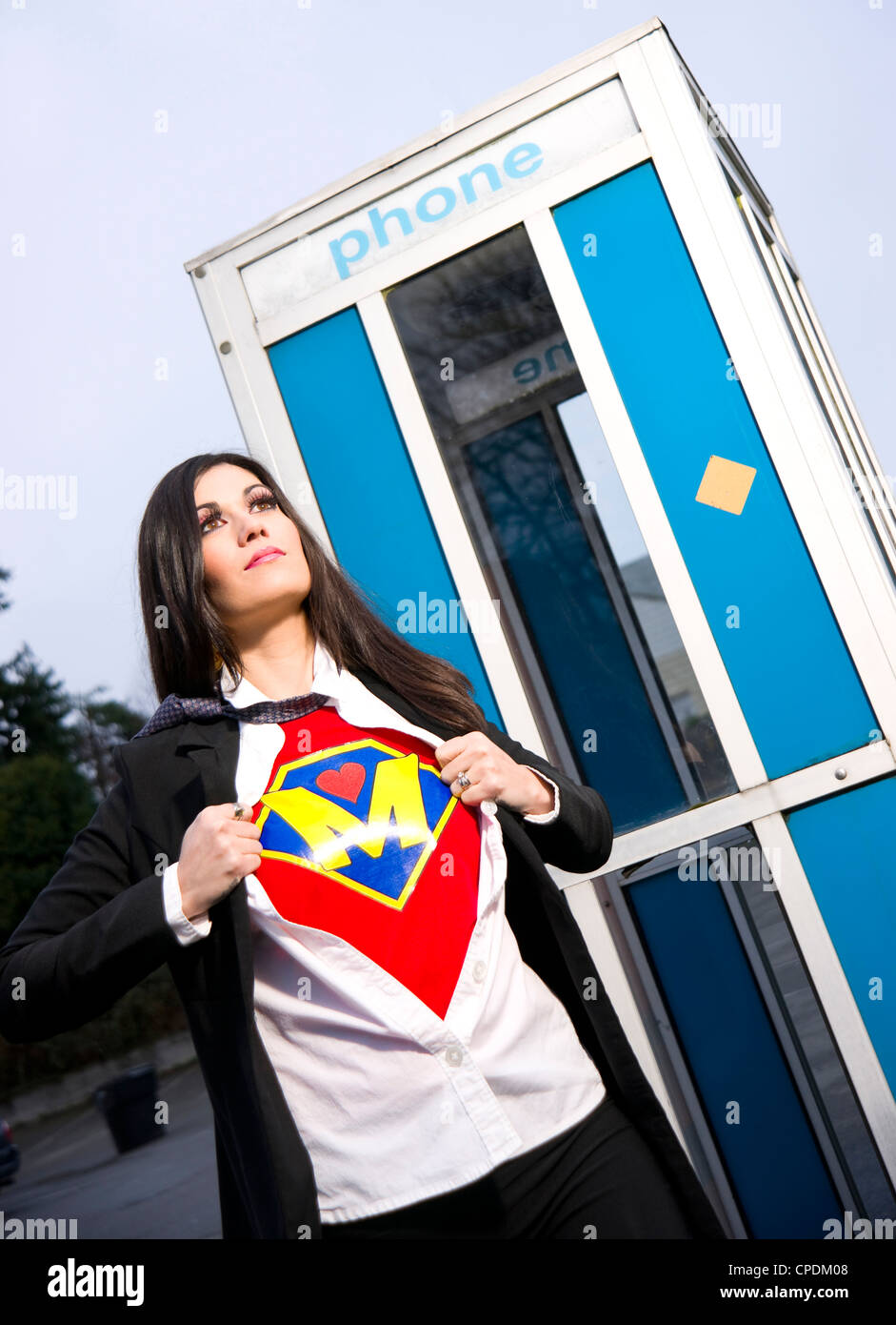 Super Megan the Super Mother comes out of the phone booth to fight fear. Stock Photo