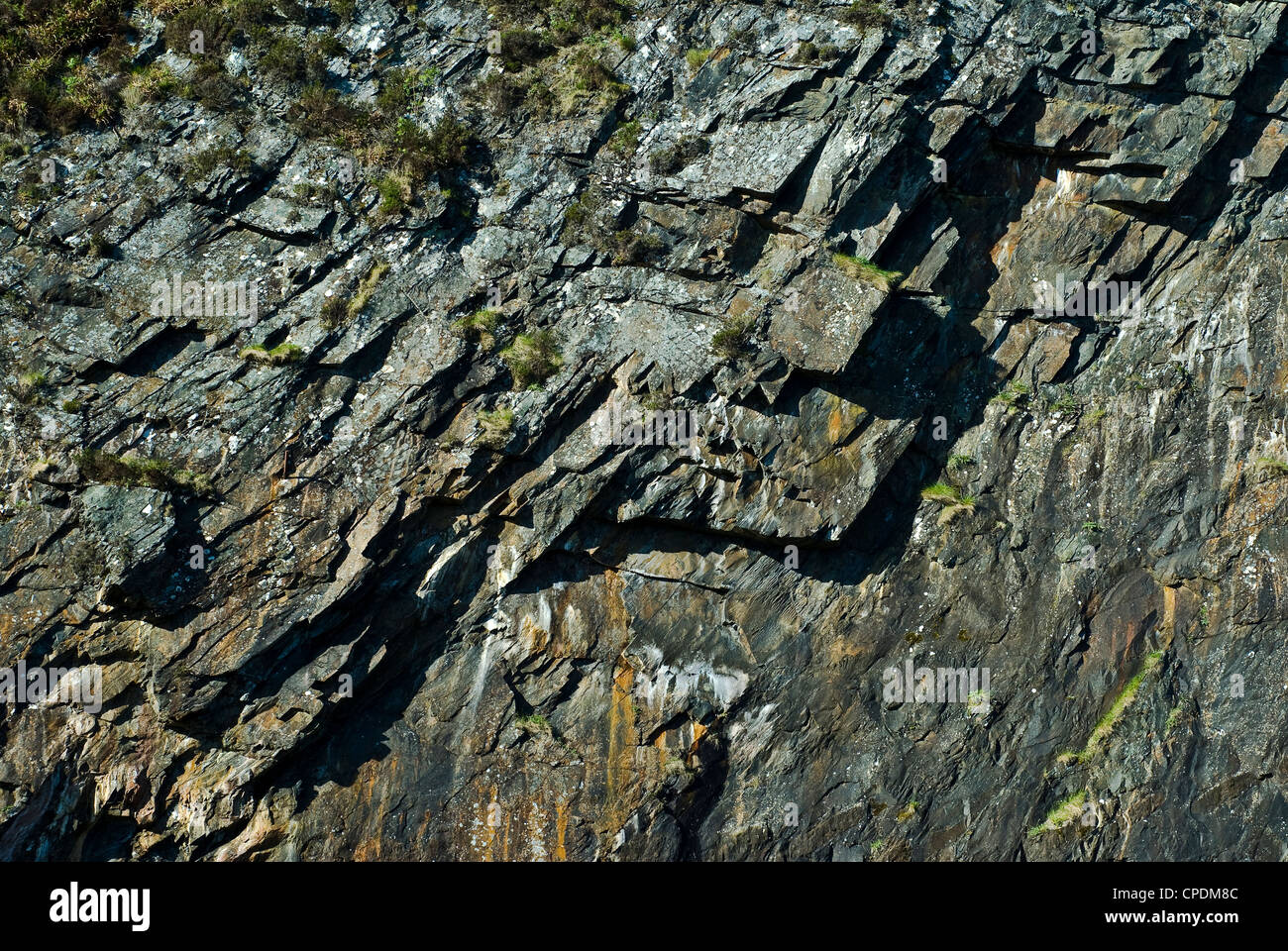 Exposed rock face on the island of Seil in Scotland Stock Photo
