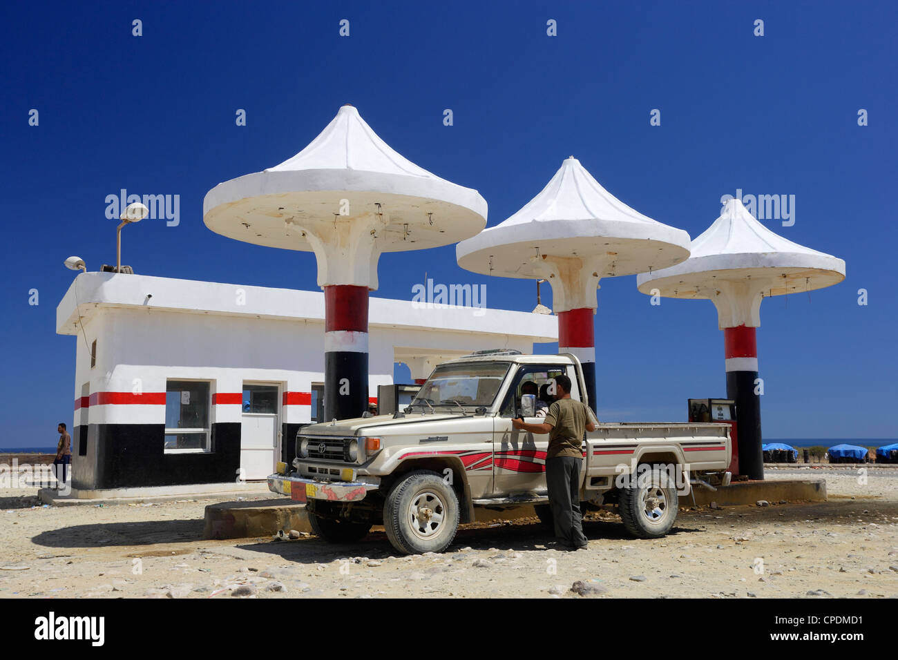Car Toyota Landcruiser filling up in a Petrol Station near the Airport