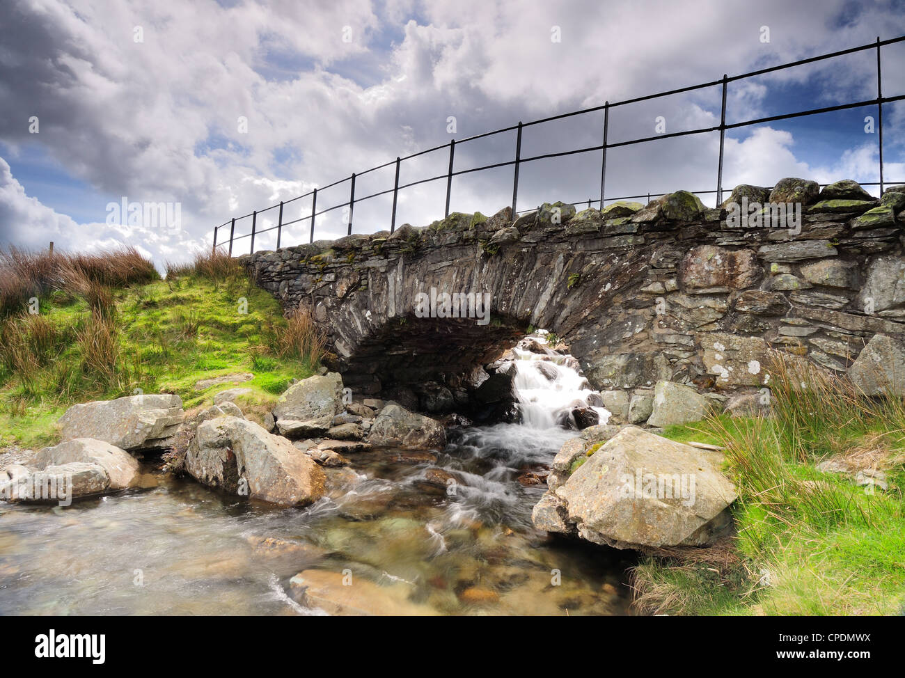 Old slate packhorse bridge on the Walna Scar Road in the English Lake District Stock Photo