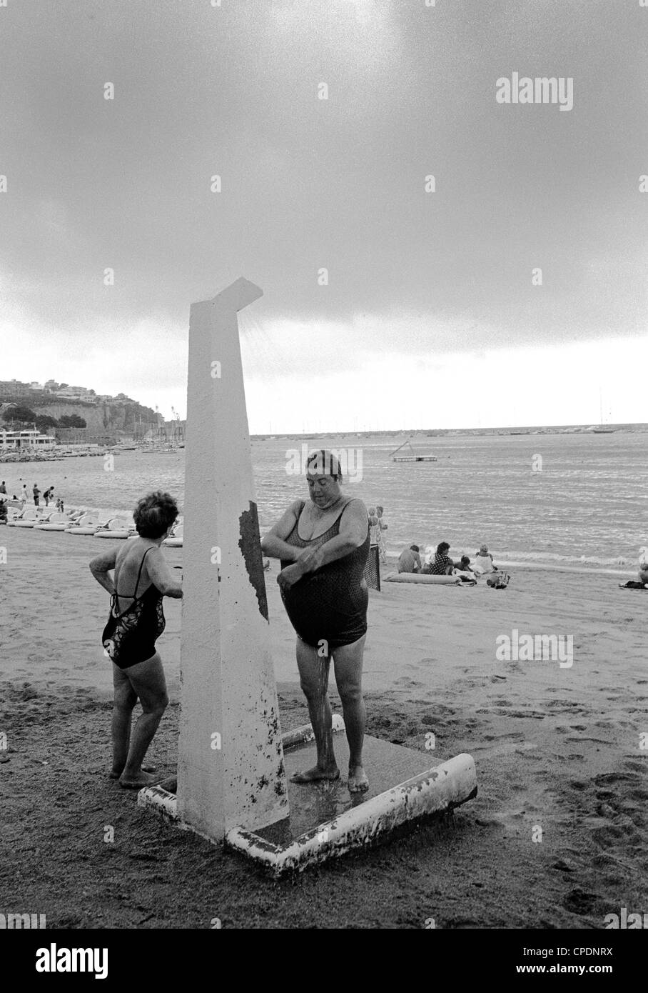 Showering on the beach Stock Photo - Alamy