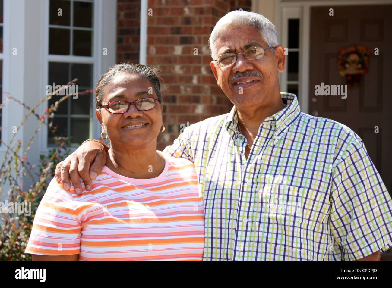Hispanic senior couple outside house hi-res stock photography and ...