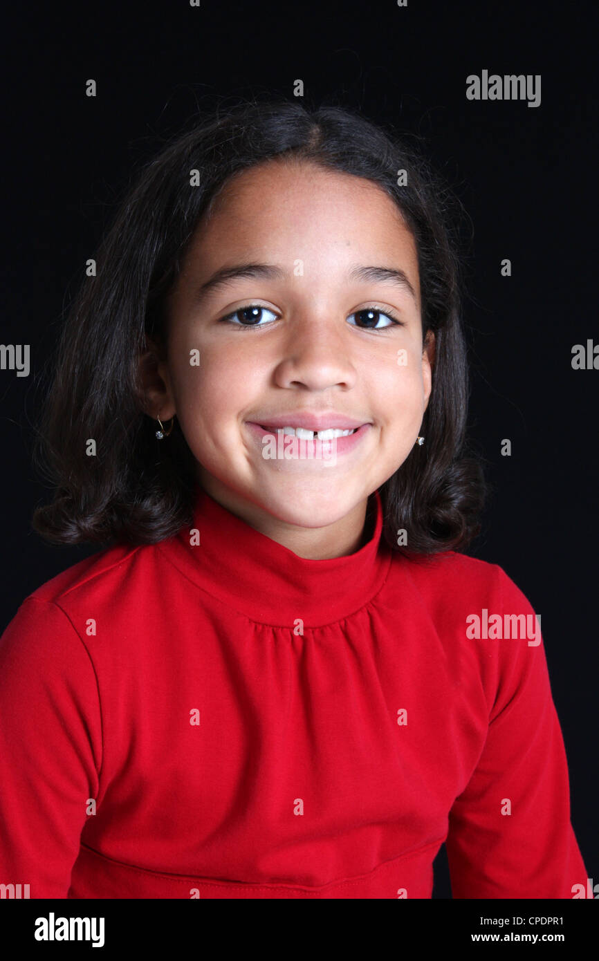 Young Girl Posing Against A Black Background Stock Photo - Alamy