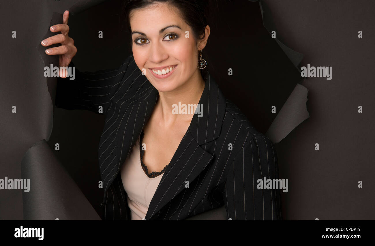 Business Woman Breaks Through Stock Photo