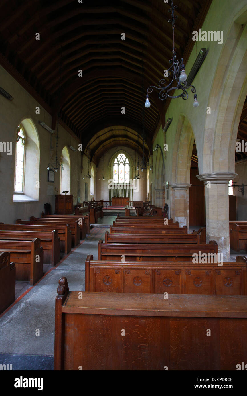 Pews and the aisle at Church of St Peter and St Paul, Shernborne, Norfolk, England, UK. Stock Photo