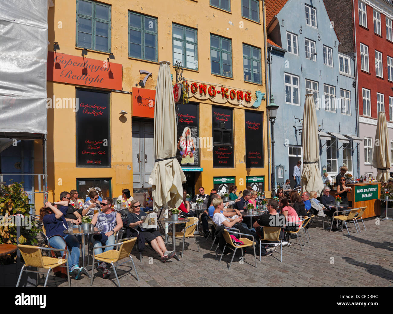 pavement restaurants in the painted buildings in the red-light district of Nyhavn Copenhagen, Denmark Photo - Alamy