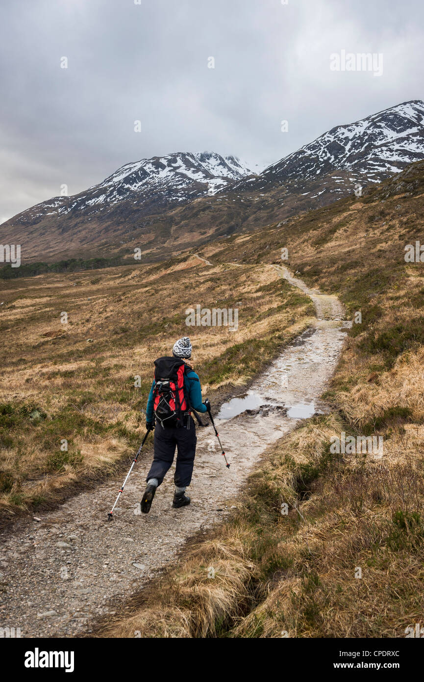 Walker walking around Glen Affric, Glen Affric, Highlands, Scotland, UK